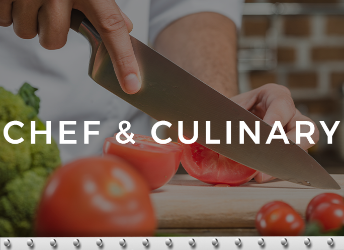 Chef slicing tomato on cutting board.
